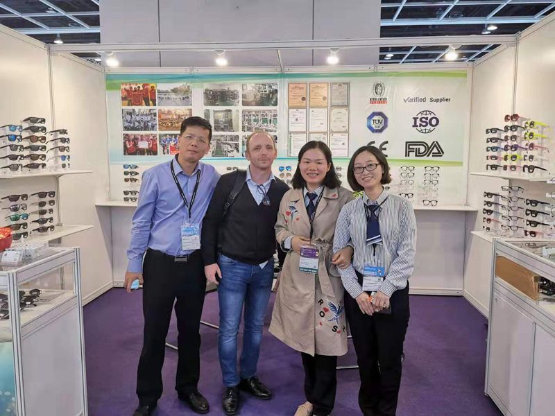 Four people at the Jiayu booth, Hong Kong Optical Fair